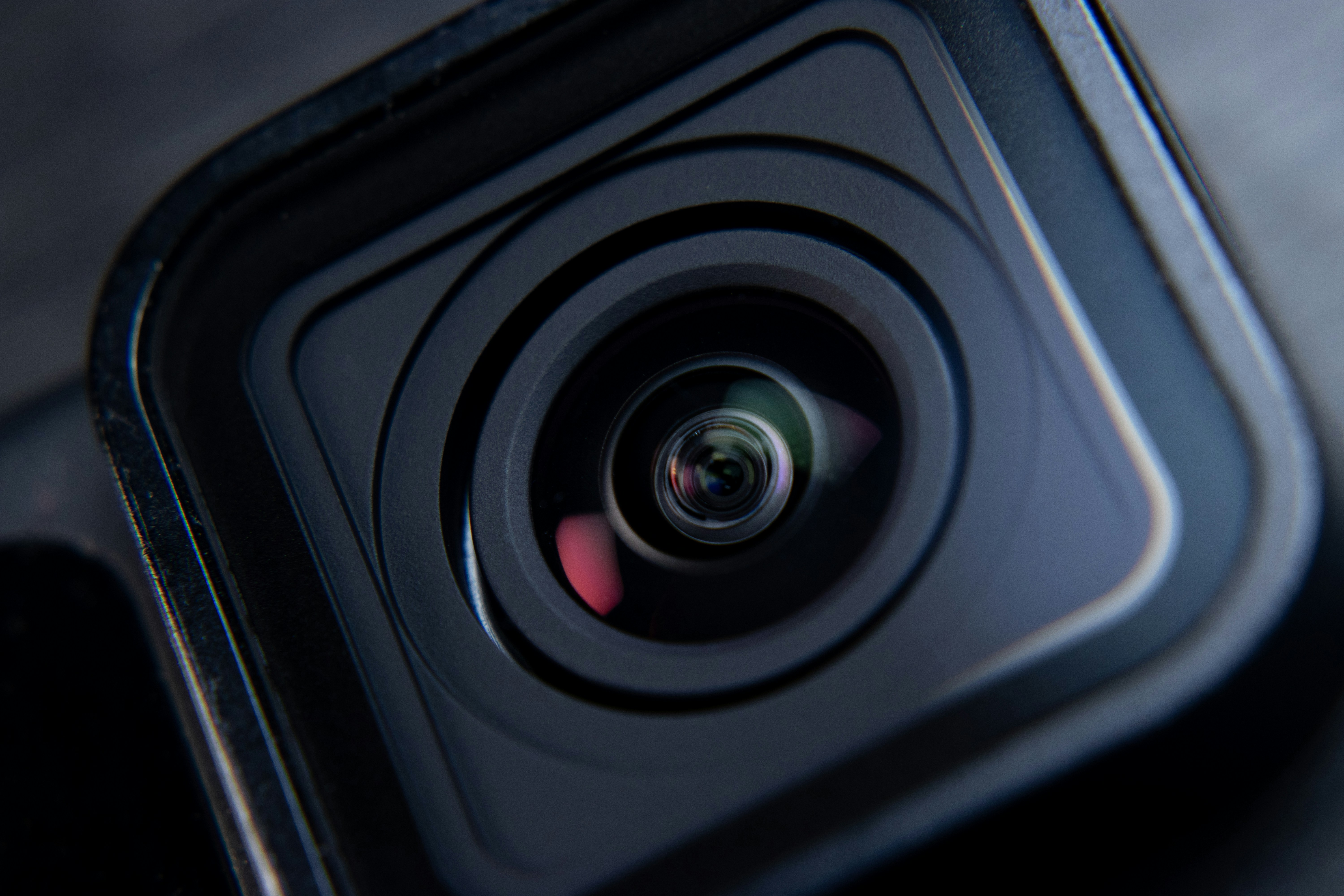 Close-up of a camera lens with reflections